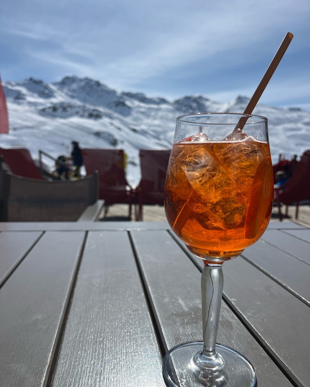 Aperol spritz on a sunny mountain terrace in Les 3 Vall&eacute;es