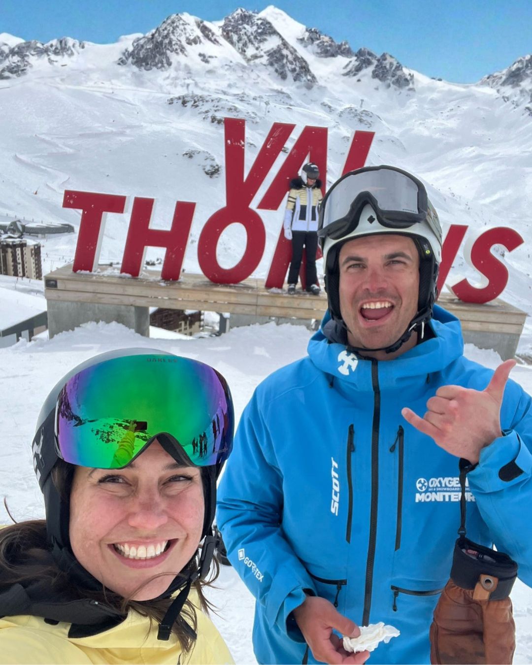 MySnow ski specialist Emily P with her ski instructor at the Val Thorens sign