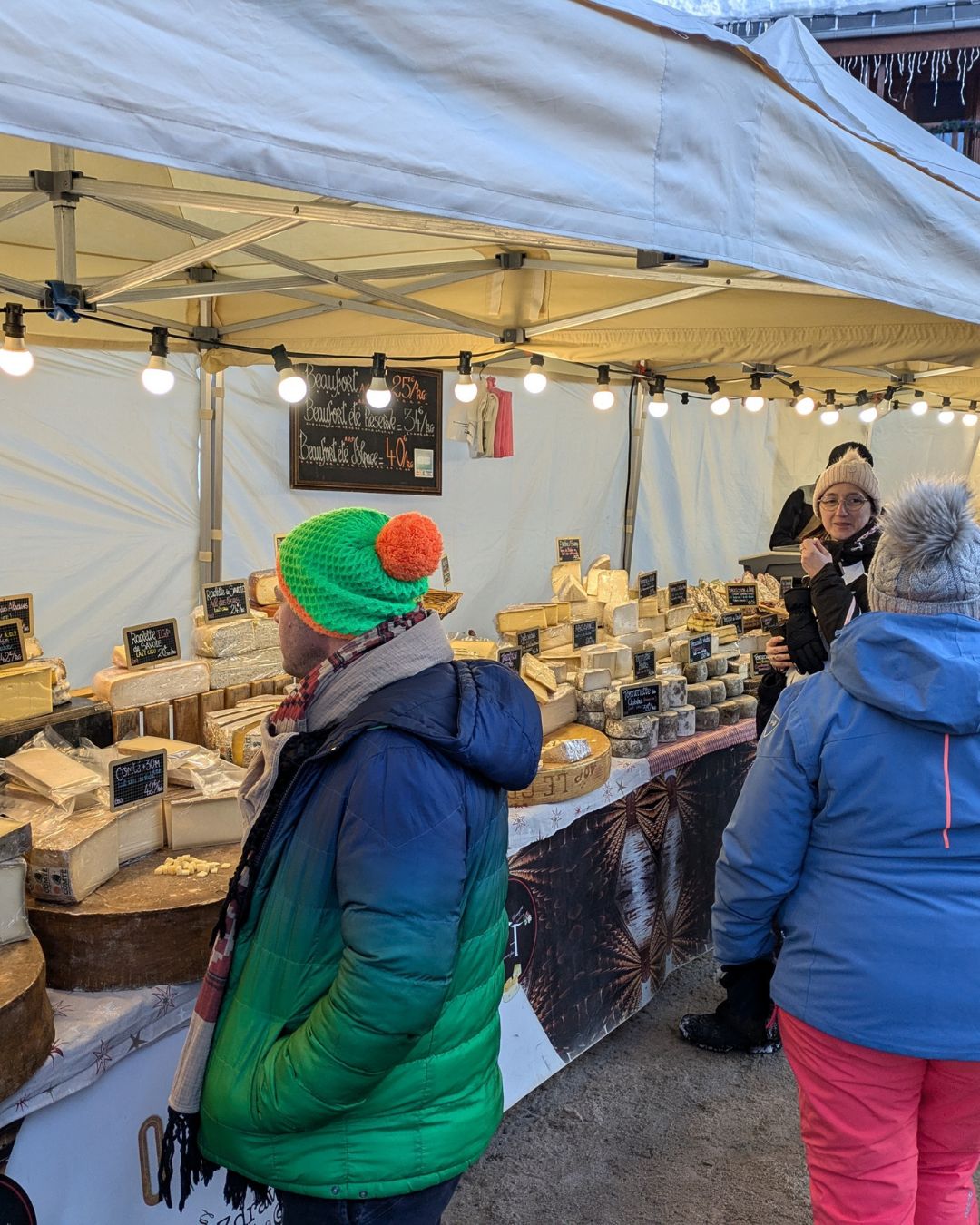 George browsing a local Beaufort cheese stall in the French Alps