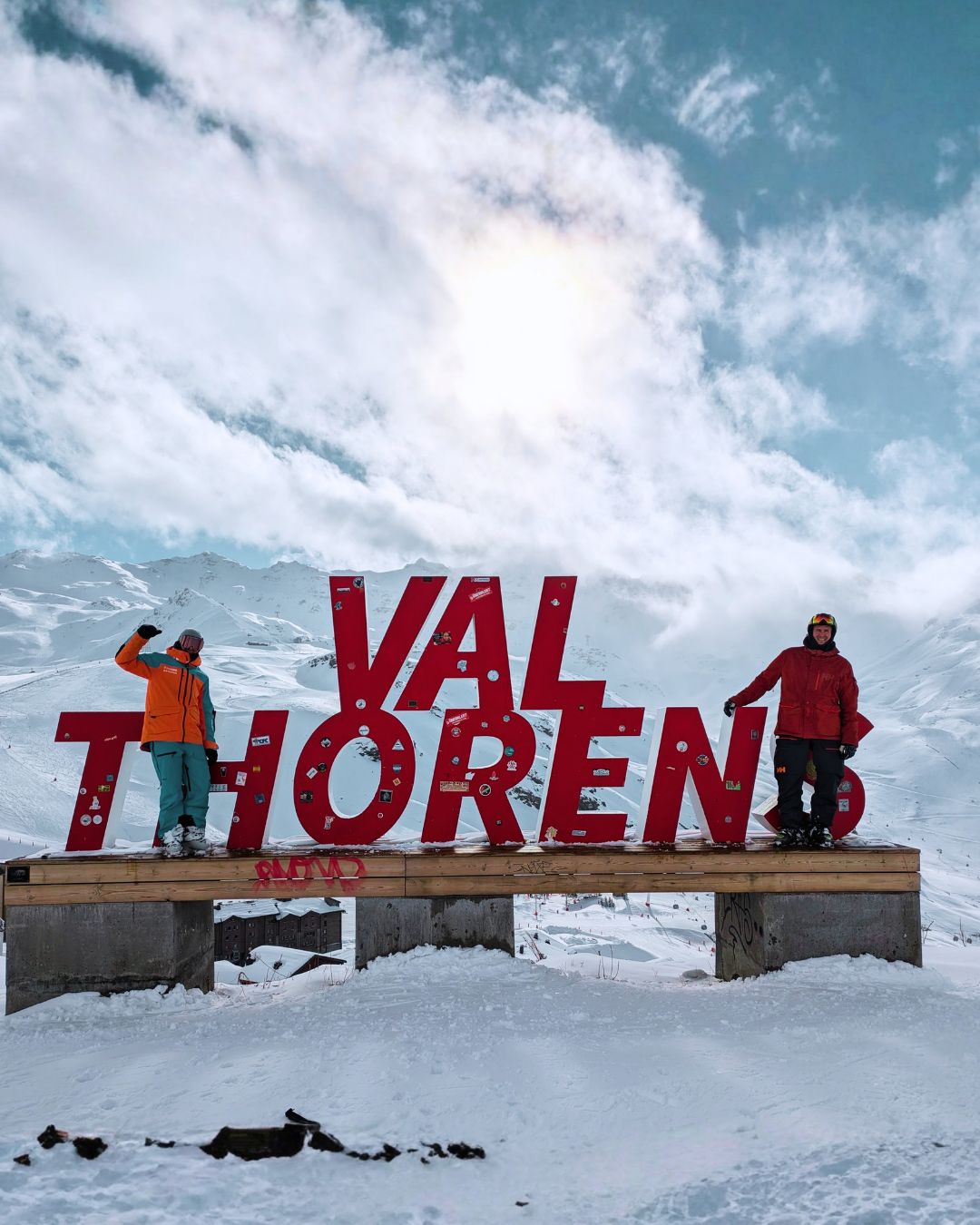 MySnow ski specialists at the Val Thorens sign