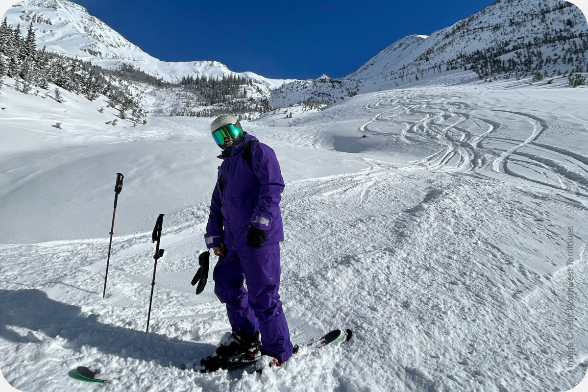 Skier in fresh snow on a heli-skiing run near Panorama